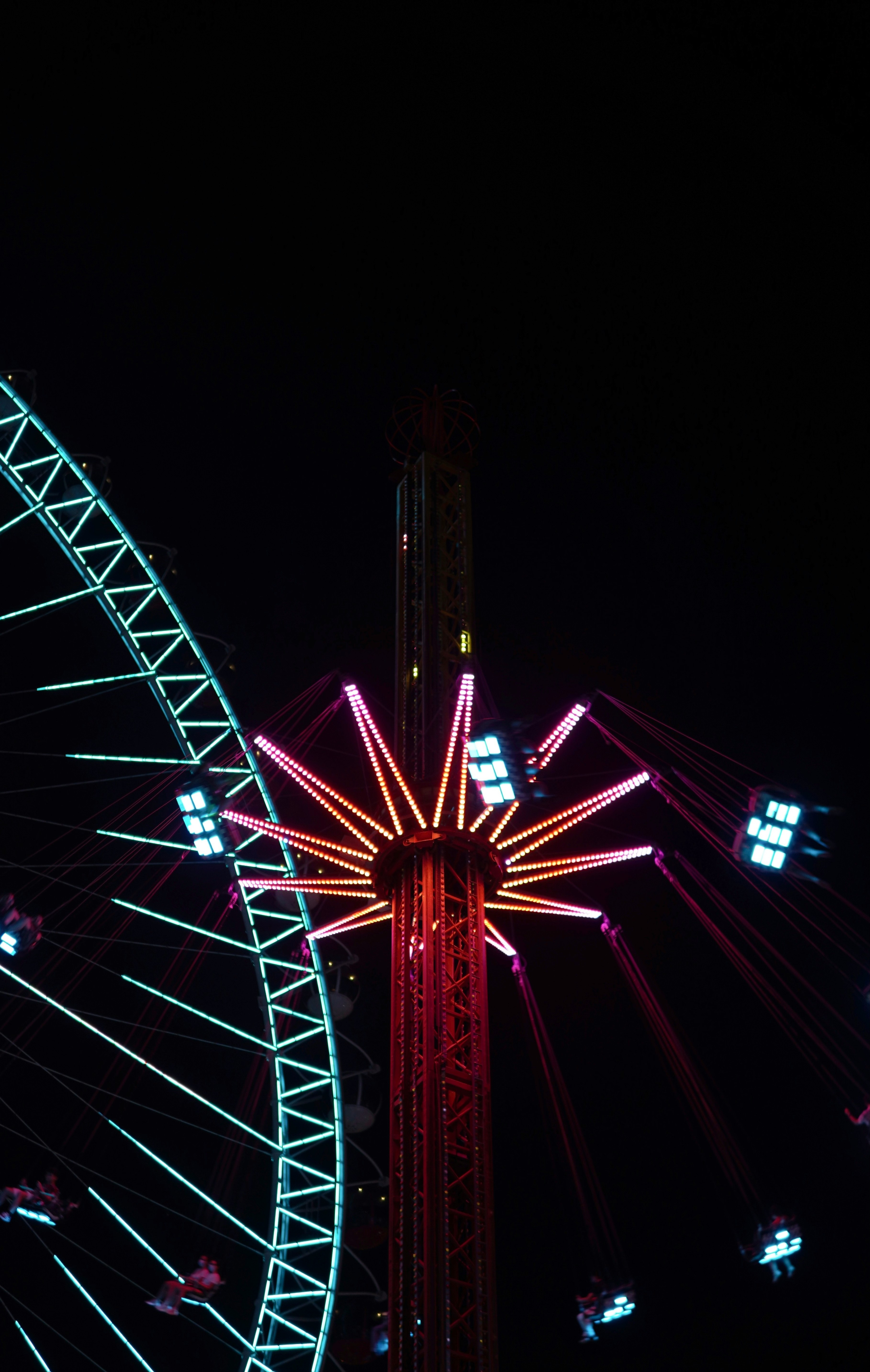 red and black ferris wheel during night time